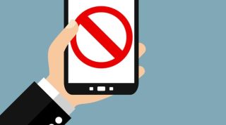 Hand holding smartphone - Forbidden, No Access or Illegal Content